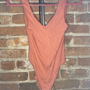 Out From Under Salmon Colored Bodysuit